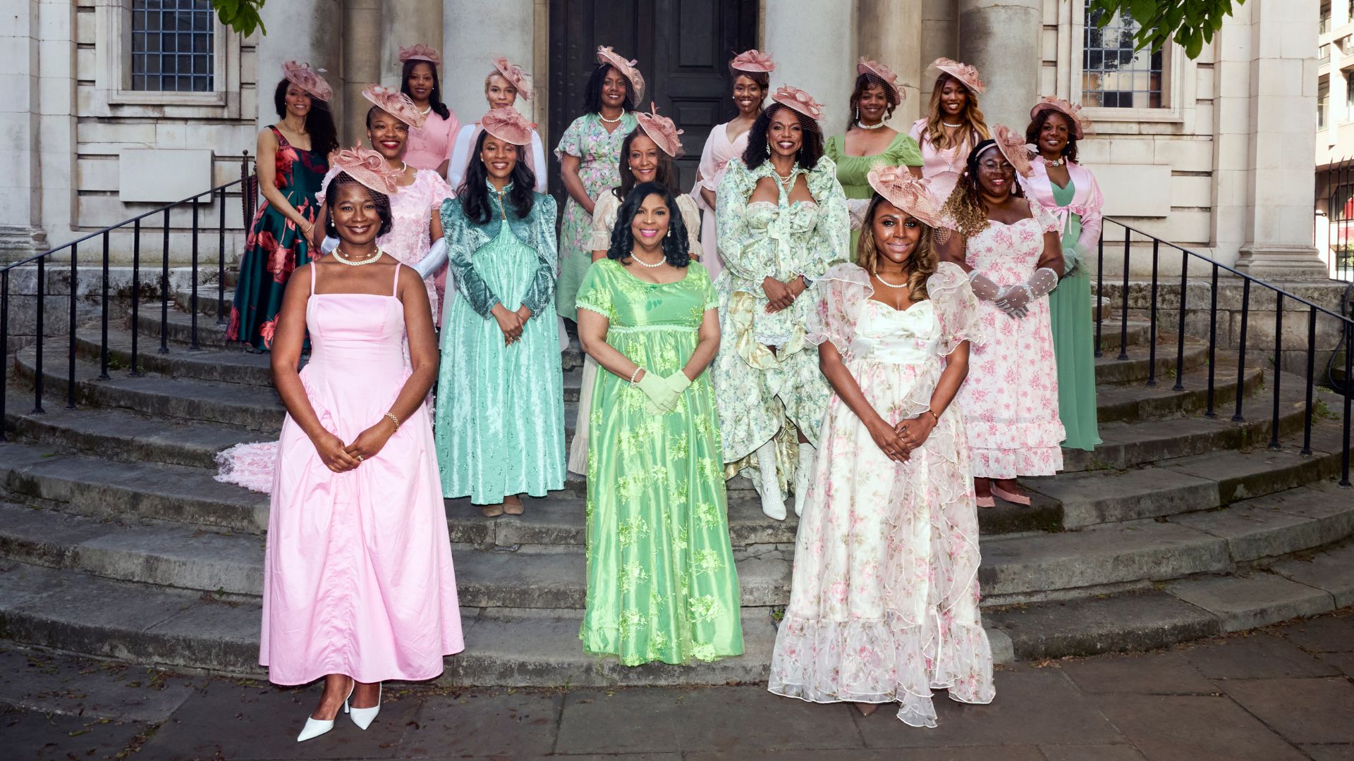 Alpha Kappa Alpha sorority members in salmon pink and apple green