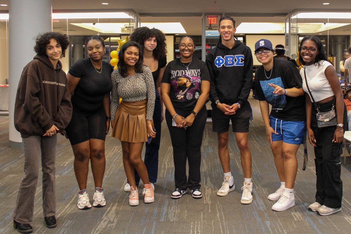 Members of the Divine Nine fraternities and sororities gathered on a college campus
