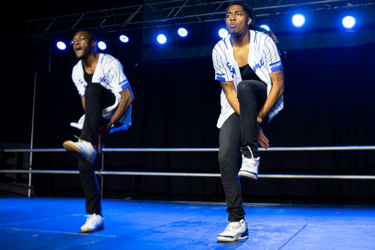 Divine Nine fraternity members performing at a step show