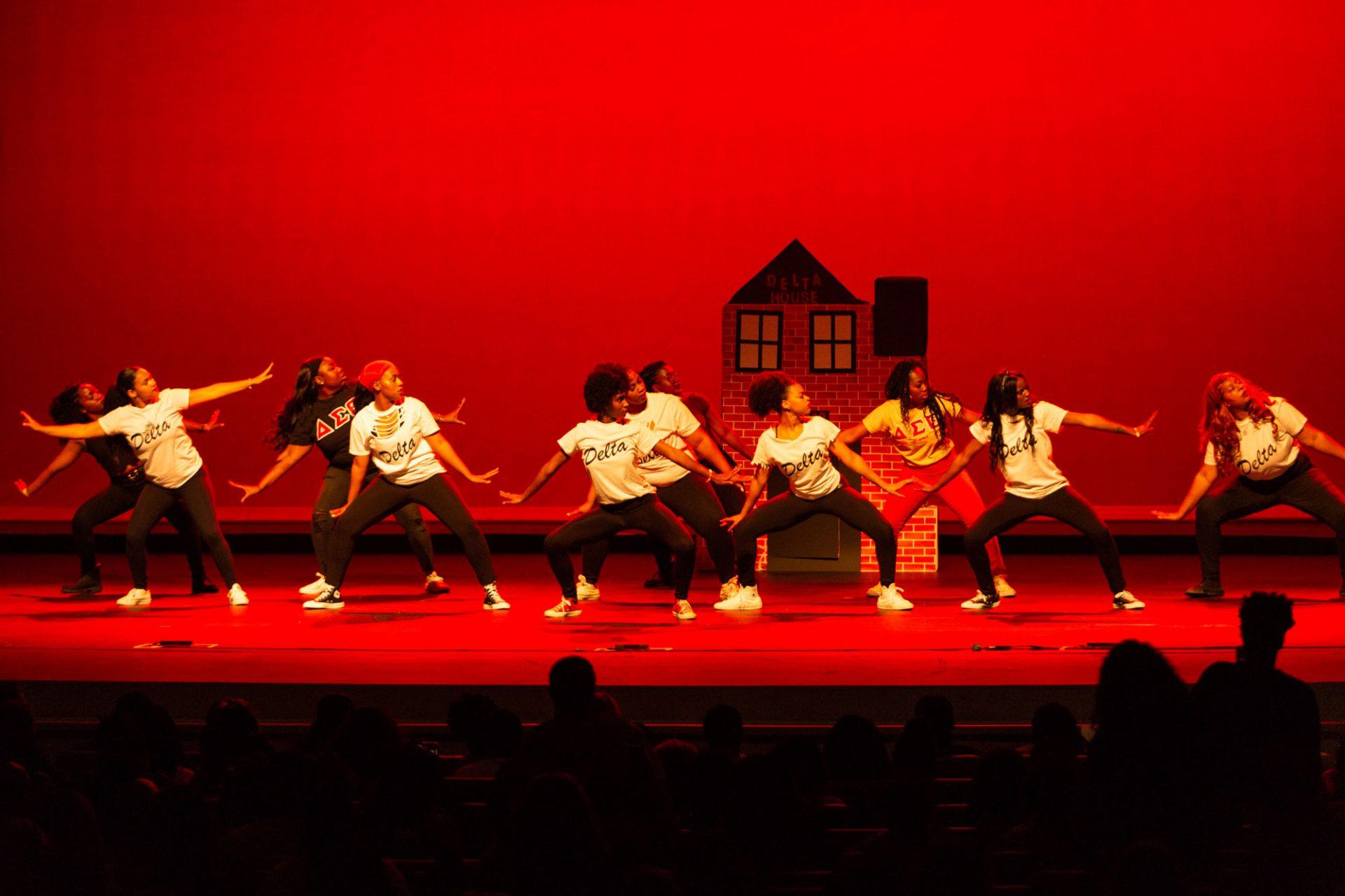 Divine Nine members performing a stroll routine with synchronized choreography