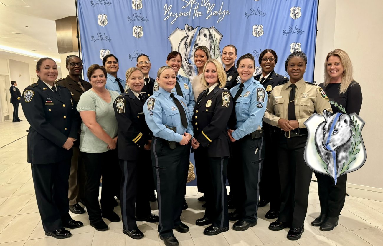 Women in military service uniforms at a community event