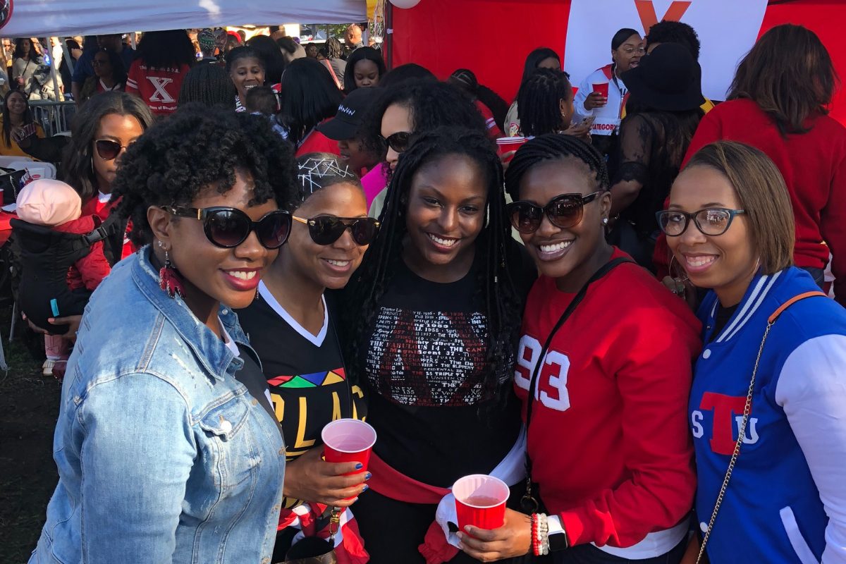Fans celebrating at an HBCU homecoming football weekend