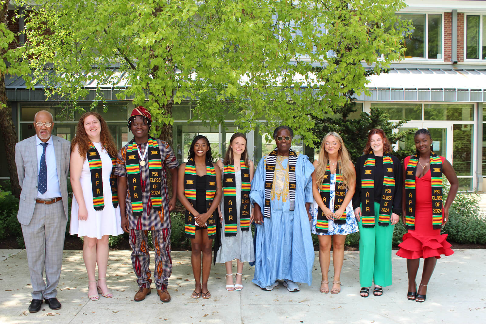 Graduates wearing Kente cloth graduation stoles at commencement