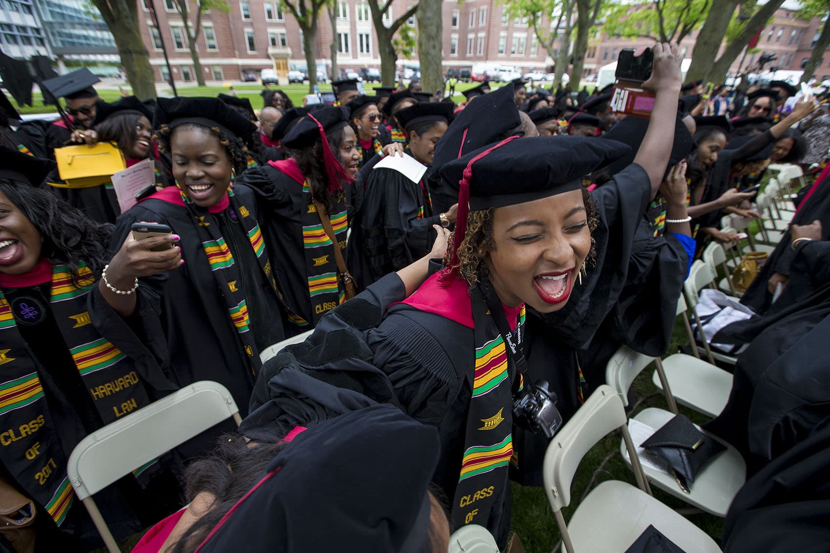 Black college graduates celebrating at commencement
